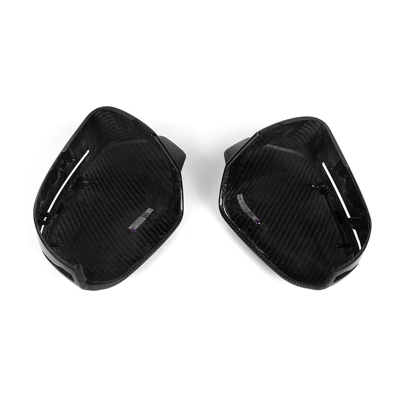 High-gloss carbon fiber side mirror covers in a horn-style design for BMW 5 Series M5 G90 G99 rear-view mirrors.